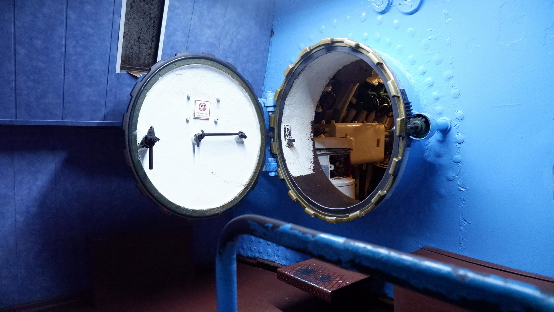 An open circular hatch reveals some internal equipment.