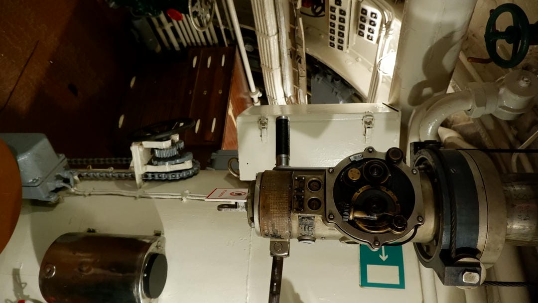 Complex machinery with multiple knobs and indicator lights.