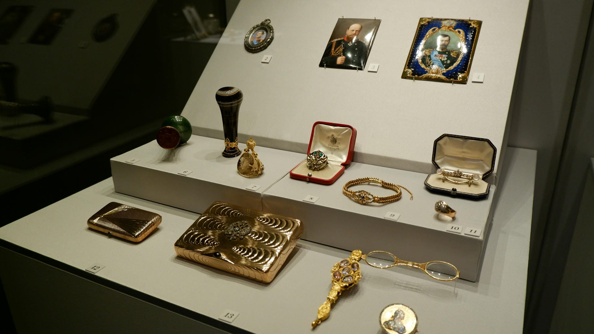 Various jewelry items, including rings, bracelets, cufflinks, and portrait miniatures.