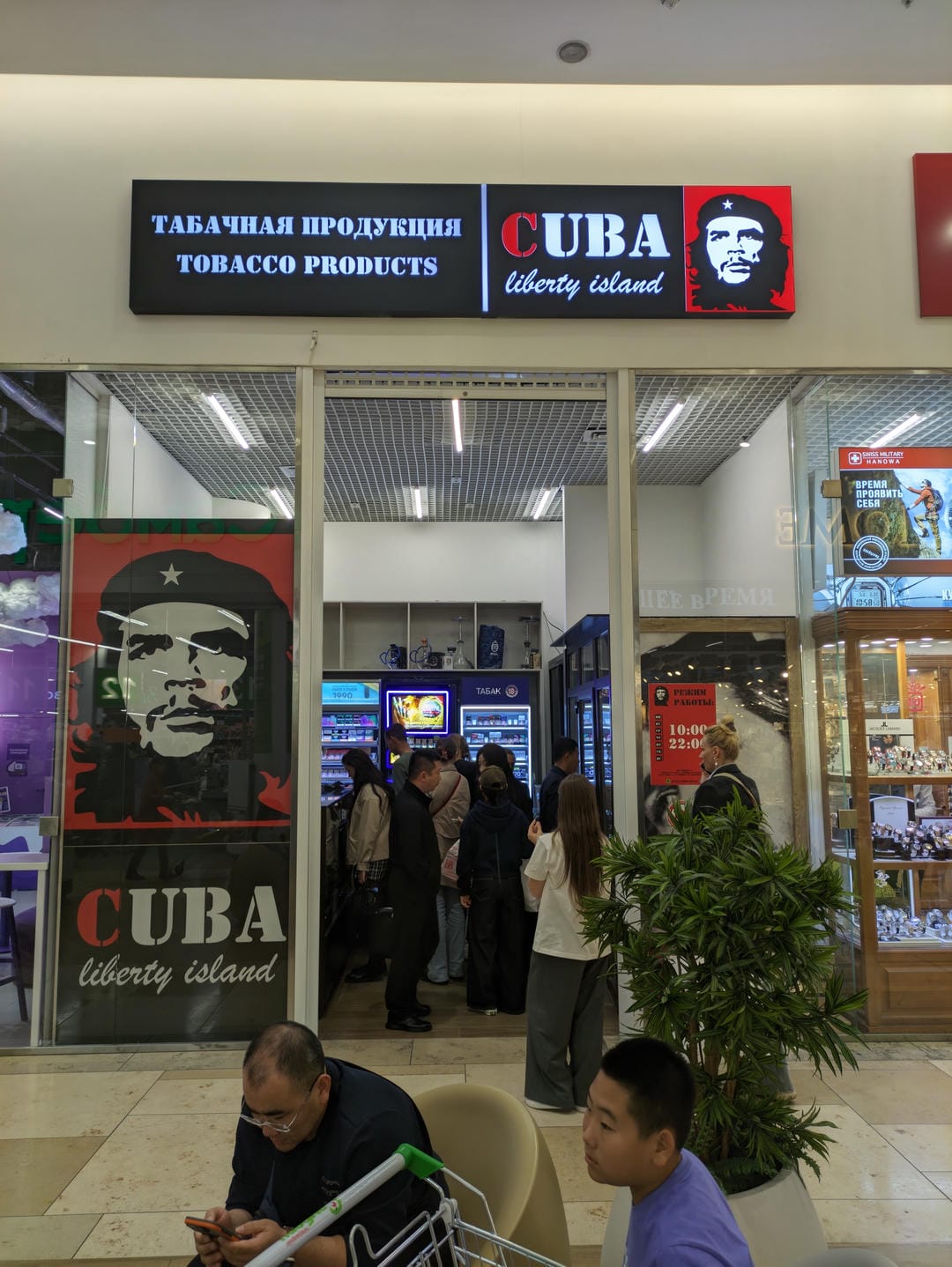 In front of a tobacco shop named CUBA, customers are queuing up.