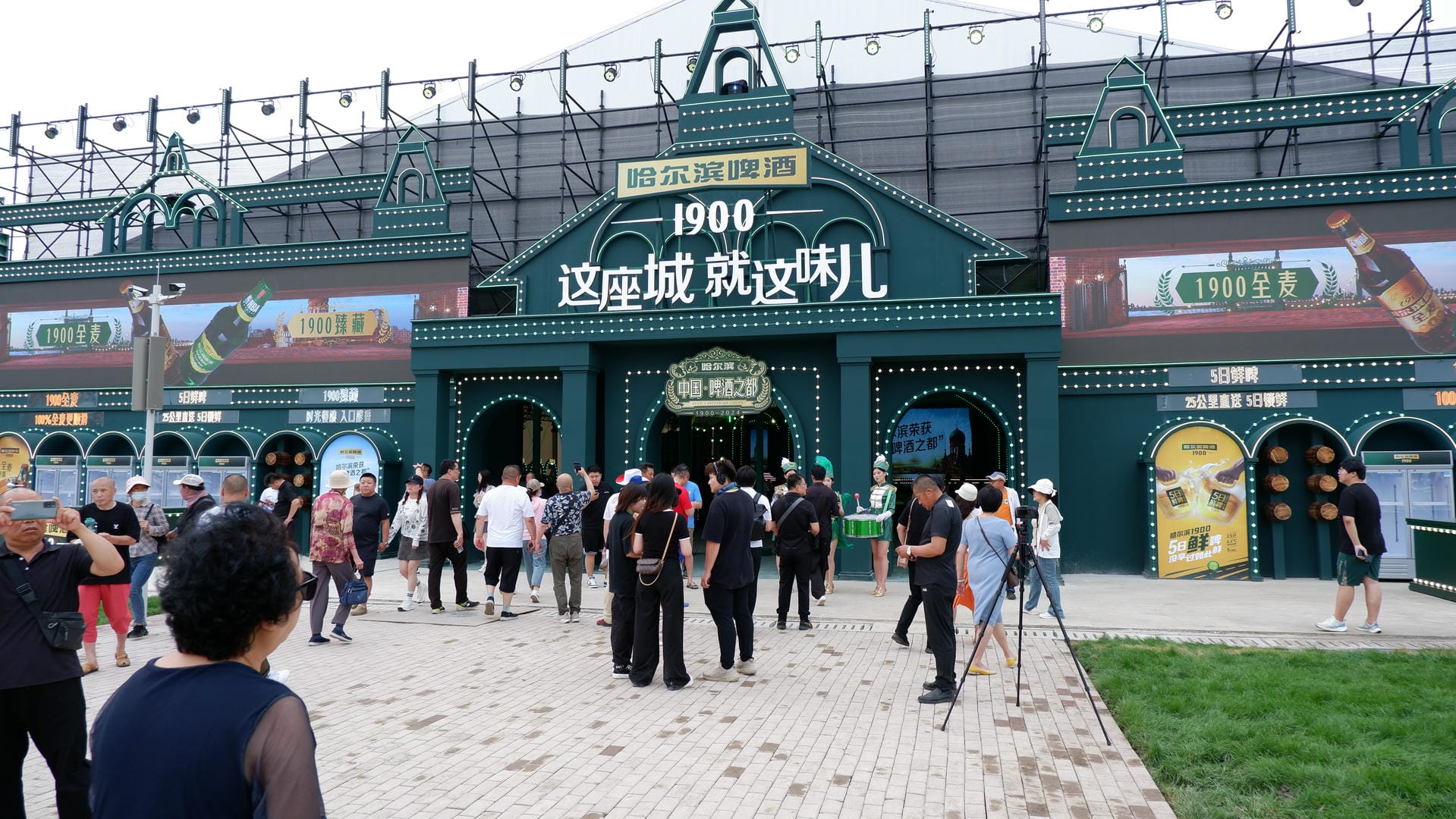 people are walking in front of a building with a sign on it