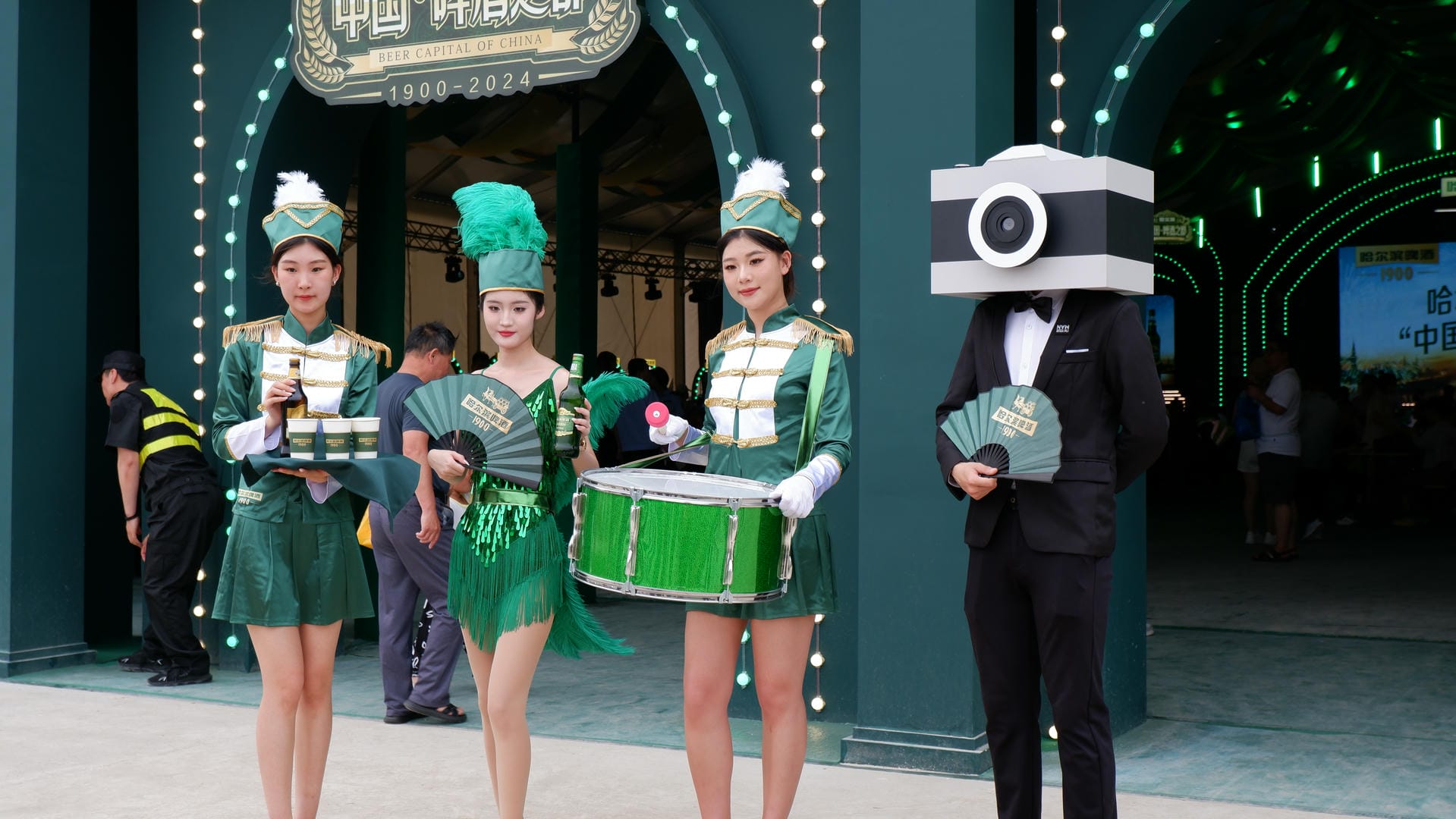 there are three girls in green costumes standing next to each other