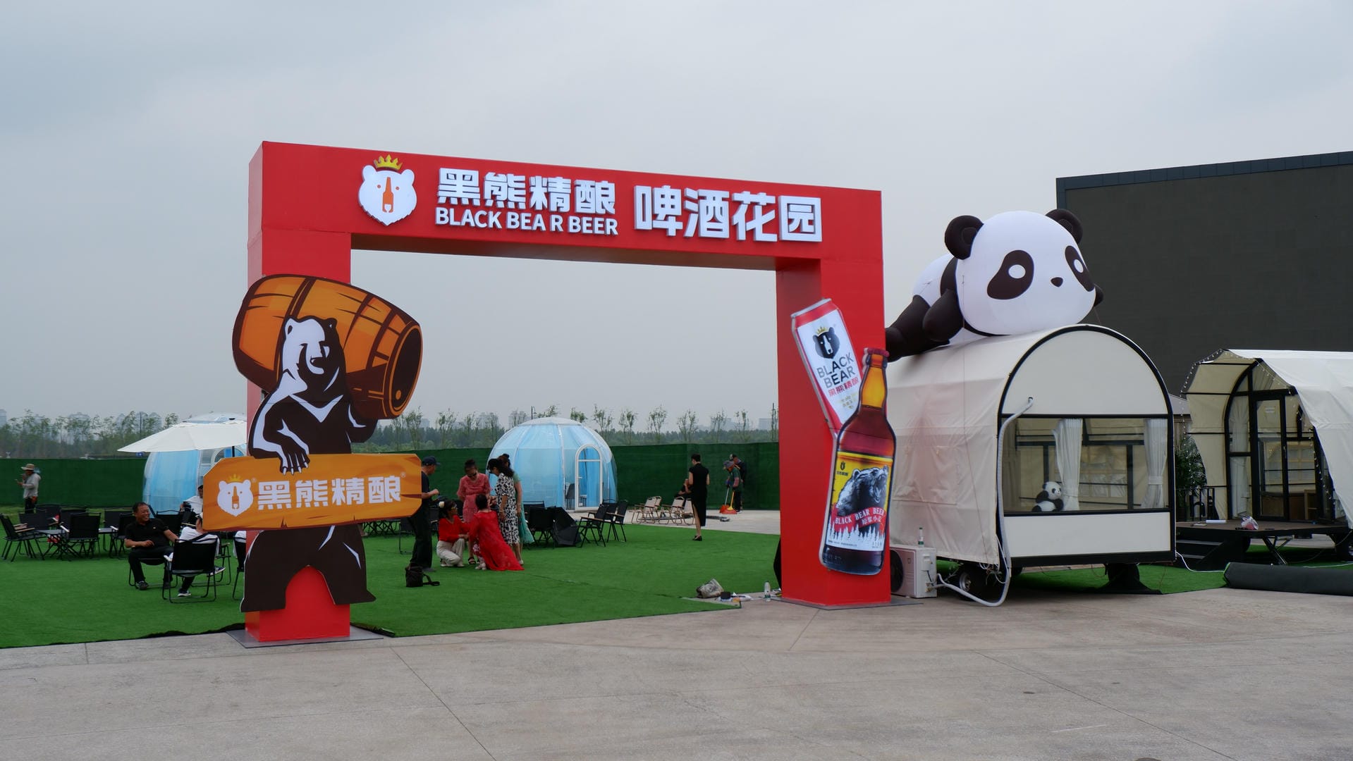 there is a giant panda bear statue in front of a building