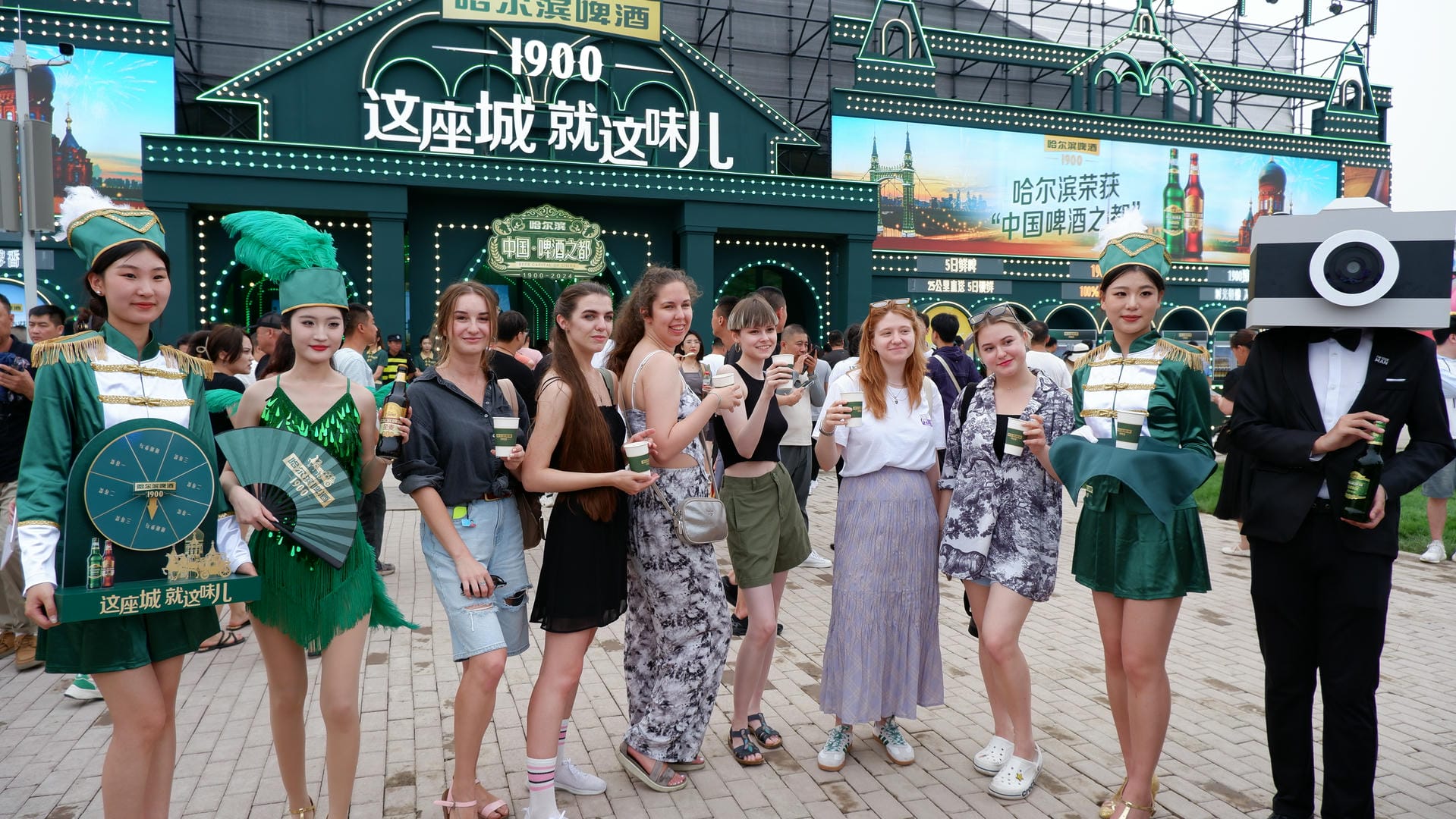 several people in costumes are posing for a picture in front of a building