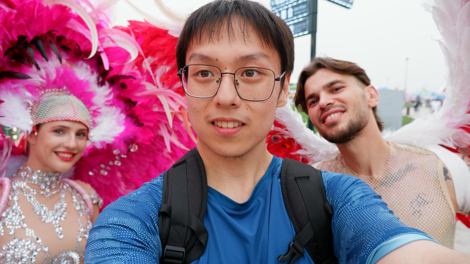 there are three people standing together in a parade with feathers