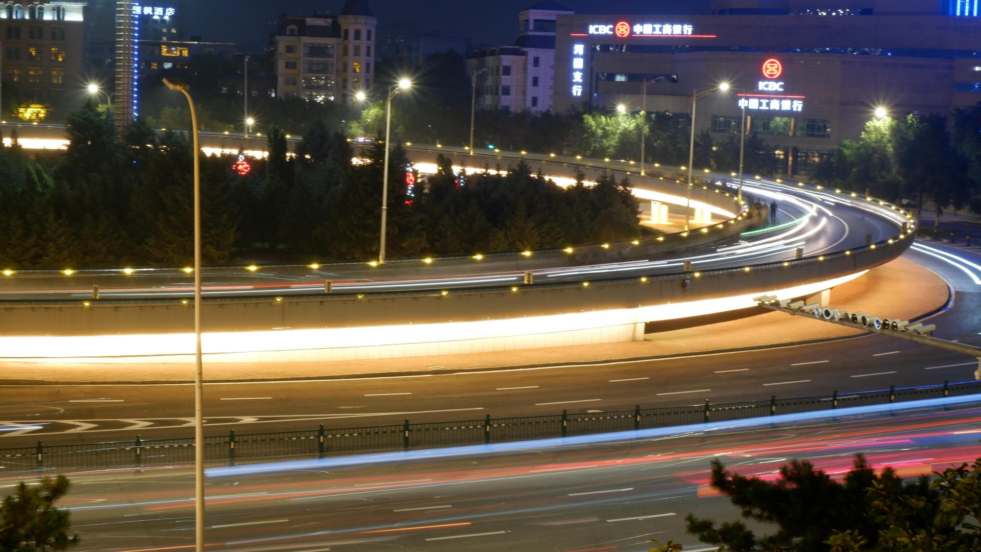 night time view of a busy city street with a lot of traffic