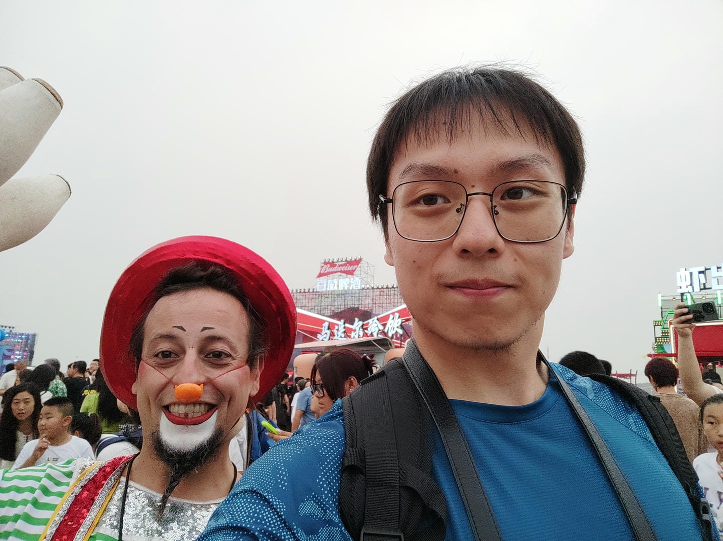 there are two men with clown faces on their faces at a carnival